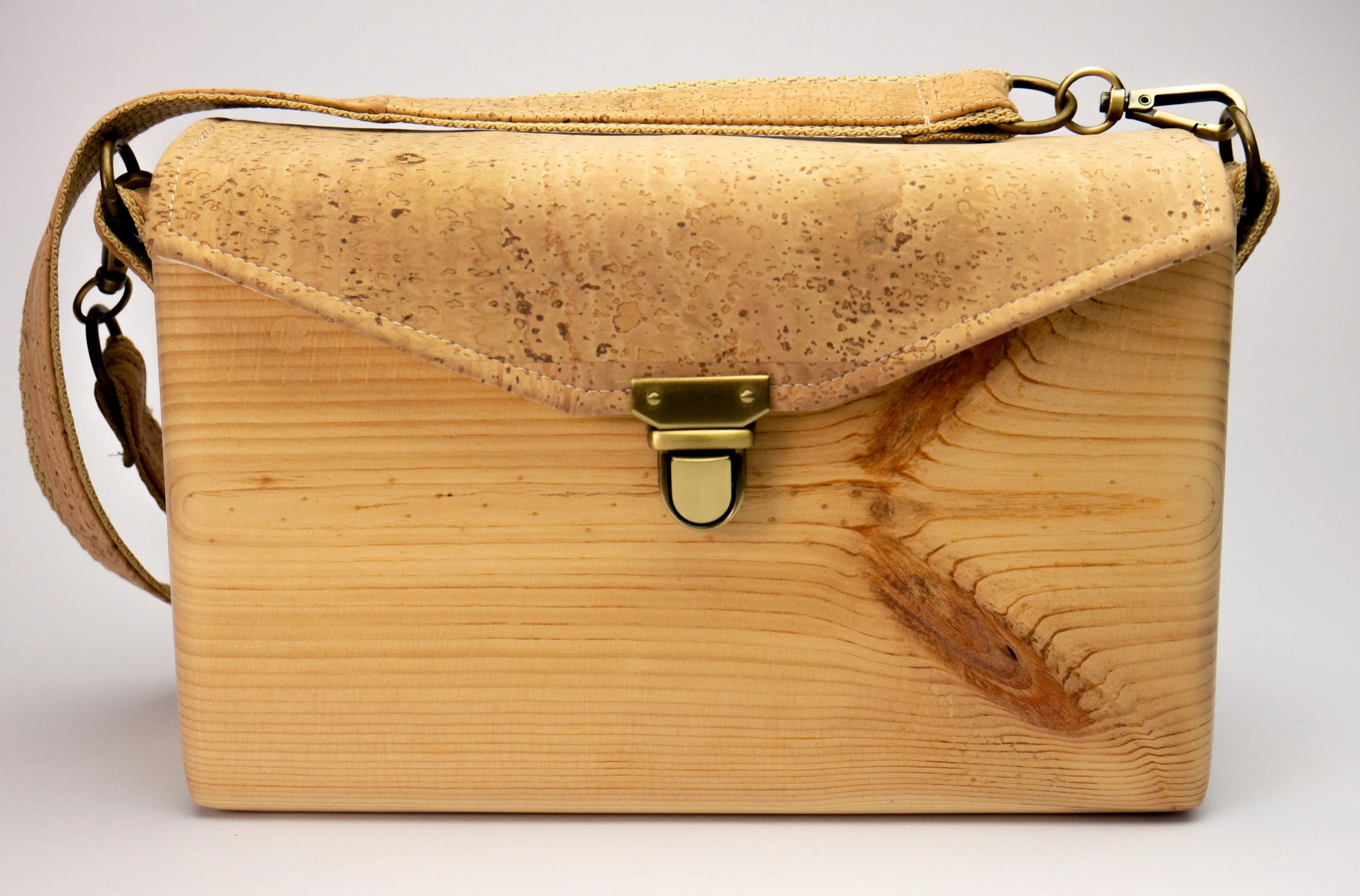 An Eco-Friendly wooden handmade crossbody bag with natural cork leather.